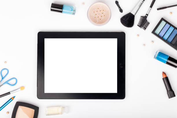 istock set of professional decorative cosmetics and makeup tools with tablet on white background with copy space for text. beauty, fashion, party and shopping concept. flat lay frame composition, top view 944152384
