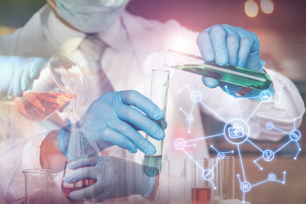 istock Double Exposure Of Scientists Holding Test Tubes And Digital Interface 944153394