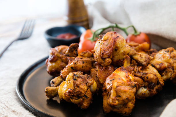 istock roasted sleeves chicken with potatoes and barbecue sauce 944154150