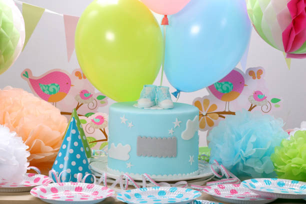 istock Birthday party with blue cake and balloons 944159378