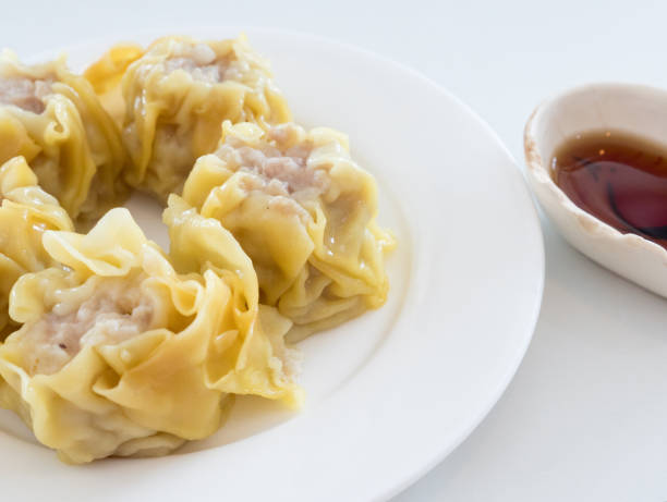 Chinese steamed dumpling on the white plate.