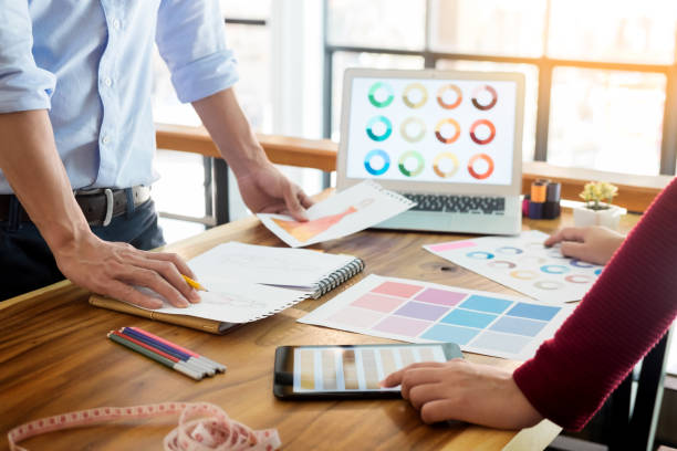 istock Midsection Of Man With Colleague Working In Creative Office 944160372