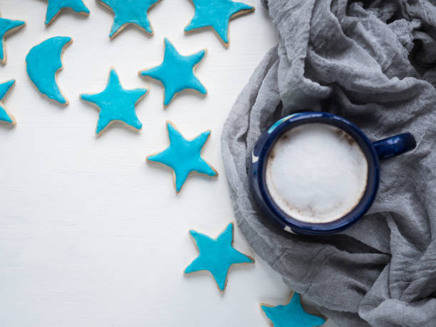 istock Cup of cappuccino and fresh festive cookies 944172252
