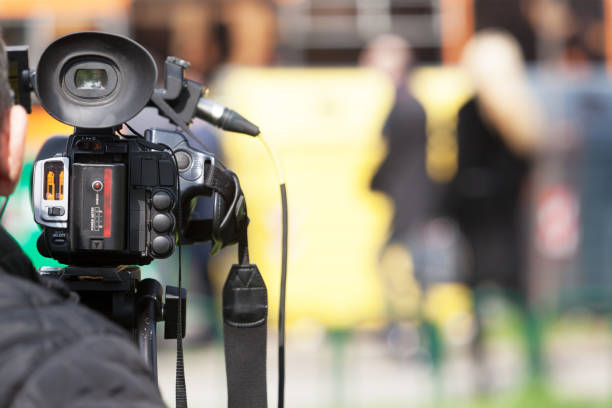 istock Covering an event with a video camera 944184120