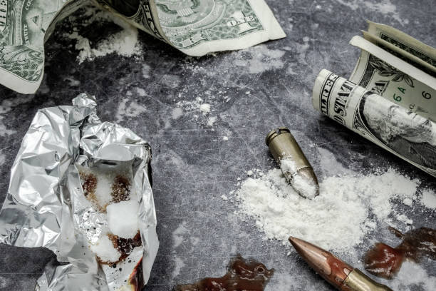 Mock-up concept of illegal drug dealing on a work surface. stock photo