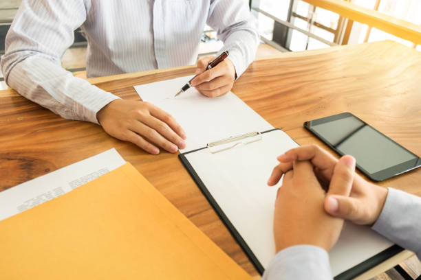 istock Midsection Of Man With Colleague Working At Office 944198698