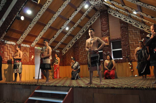 Tamaki Maori dancers in traditional dress at Whakarewarewa Thermal Park ROTORUA, NEW ZEALAND, November 12, 2016: Tamaki Maori dancers in traditional dress at Whakarewarewa Thermal Park whakarewarewa stock pictures, royalty-free photos & images