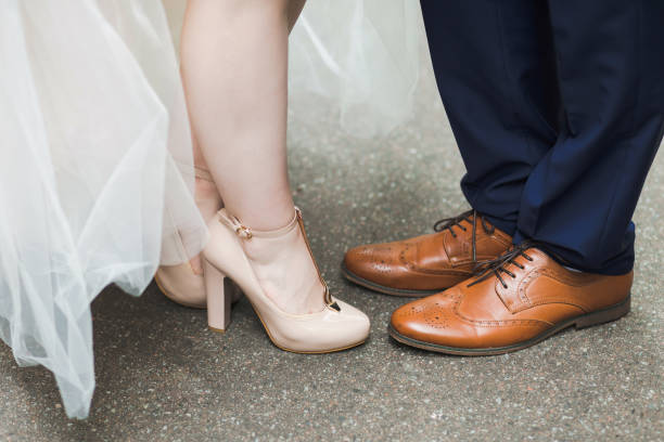 istock wedding couple posing outdoors for professional photographer 944209226