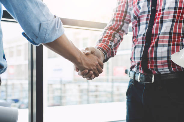 istock Meeting and greeting, Two engineer or architect meeting for project, handshake after consultation and conference new project plan, contract for both companies, success, partnership 944211516
