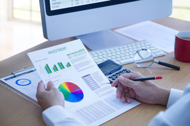 istock Reviewing annual reports in business investment analysis 944220968