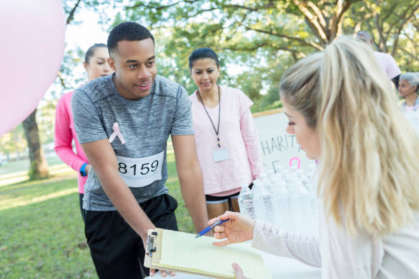 istock Young man registers for charity event 944221980