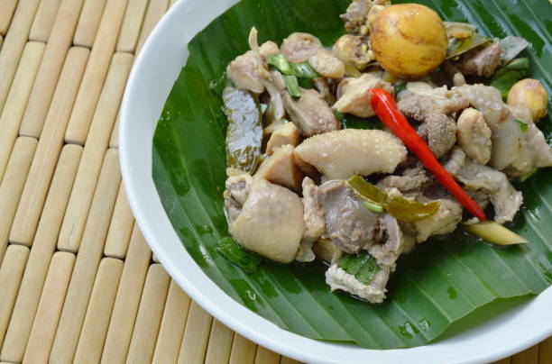 istock spicy boiled chicken and entrails salad on banana leaf 944222228