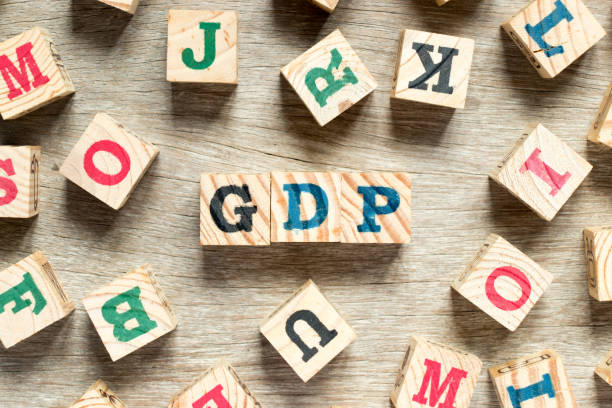 istock Letter block in word GDP with another on wood background 944237540