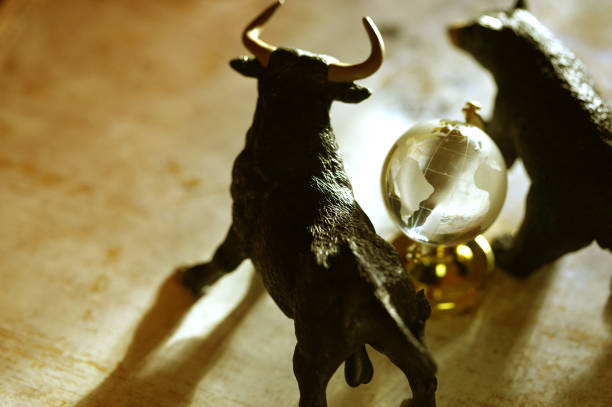 Bull and bear market shot of figurine bull and bear with hour glass stock market and exchange photos stock pictures, royalty-free photos & images