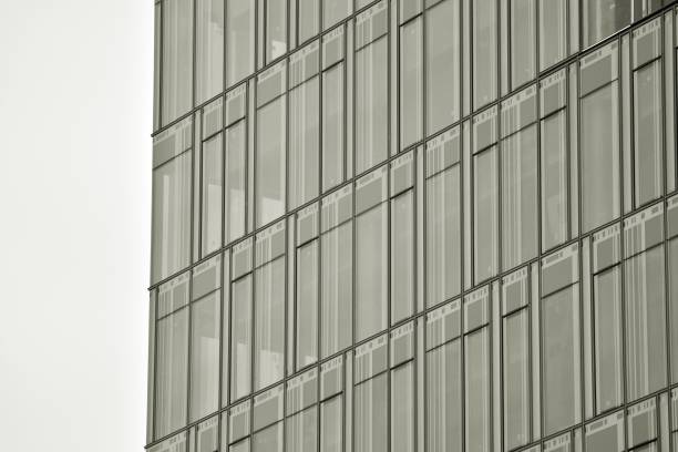 Detail of scaffolding and netting on a  building facade, construction site . Restoring and repairing. Full frame view. Galicia, Spain.