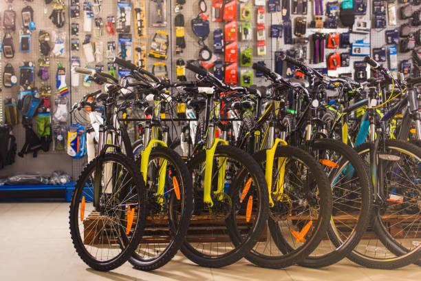 new modern bicycles selling in bike shop new modern bicycles selling in bike shop bicycle shop stock pictures, royalty-free photos & images