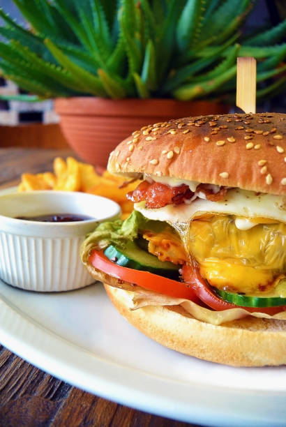 istock Homemade Bacon Hamburger with Egg cheese and vegetables 944255640