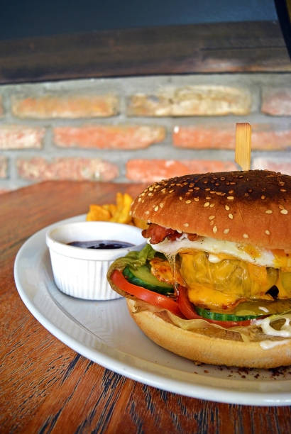 istock Homemade Bacon Hamburger with Egg cheese and vegetables 944255748
