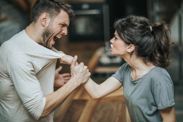 istock Aggressive couple arguing about their problems at home. 944258940