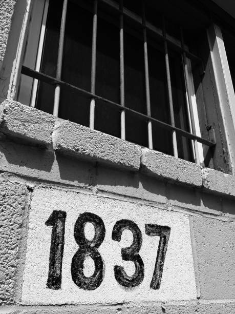 istock Building address and Barred Windows 944260372