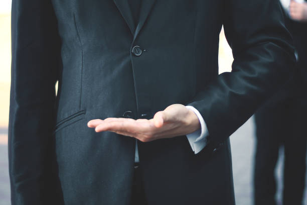 istock close up.businessman with empty hand on blurred background 944266730