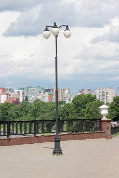 istock Pavement with beautiful lanterns in a big city. 944269988