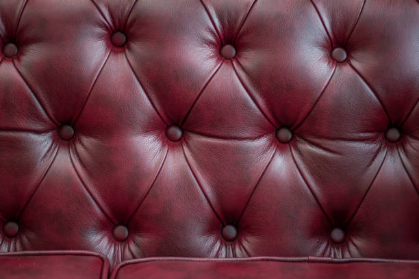 istock Closeup texture of vintage red leather sofa for background 944270920