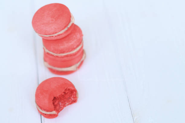 istock Colorful macaroons and flowers on table 944271300