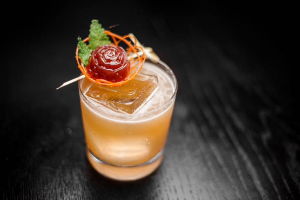 istock Cocktail glass filled with decorated orange alcoholic cocktail 944272132