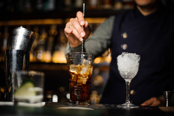 istock Barman making a fresh cocktail in a glass 944272508
