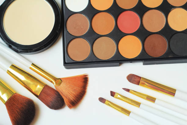 istock close up.set of makeup brushes and eyeshadow on white background 944274964