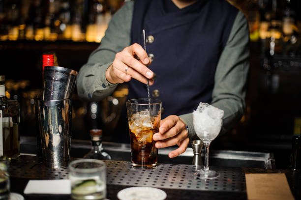 istock Barman making an alcoholic cocktail in a glass 944276006