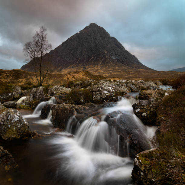 Buachaille etive Mor The beautiful waterfall with in the background the Buachaille in Glencoe area Scotland buachaille etive mor photos stock pictures, royalty-free photos & images
