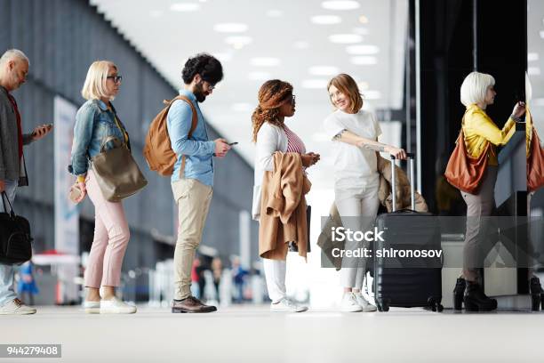 Queue Of Passengers Stock Photo - Download Image Now - Waiting In Line, Airport, People