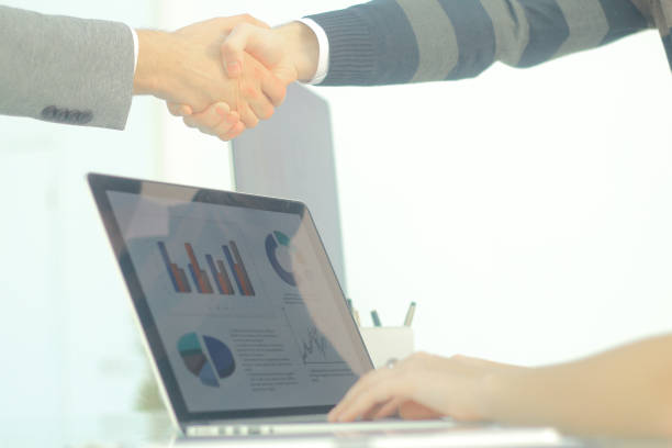 istock closeup.background image handshake financial partners 944279596