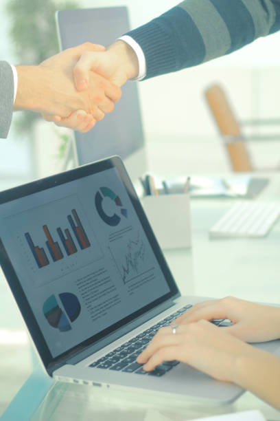 istock closeup.background image handshake financial partners 944279698