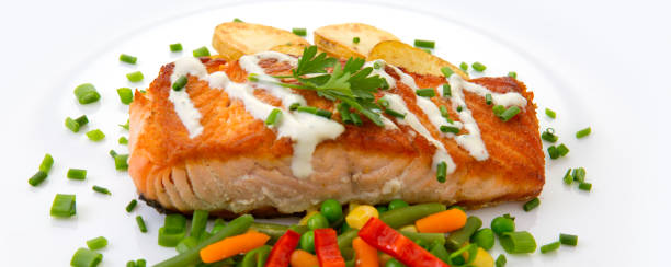 istock Salmon Steak with Vegetables and fried potatoes 944282288