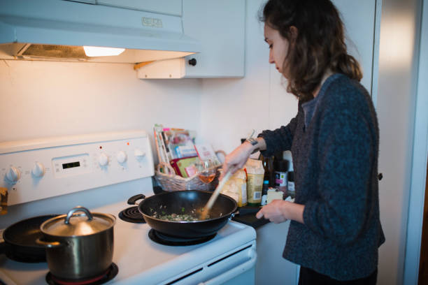 istock Young woman cooking in the kitchen 944295216