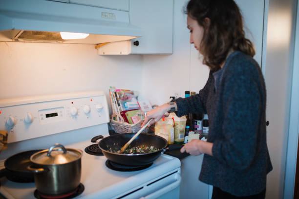 istock Young woman cooking in the kitchen 944295222