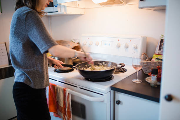 istock Young woman cooking in the kitchen 944297490