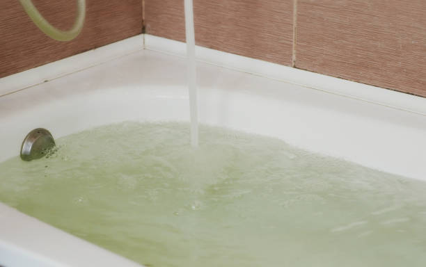 istock Water poured into the tub. Full bath. Close up. 944299770