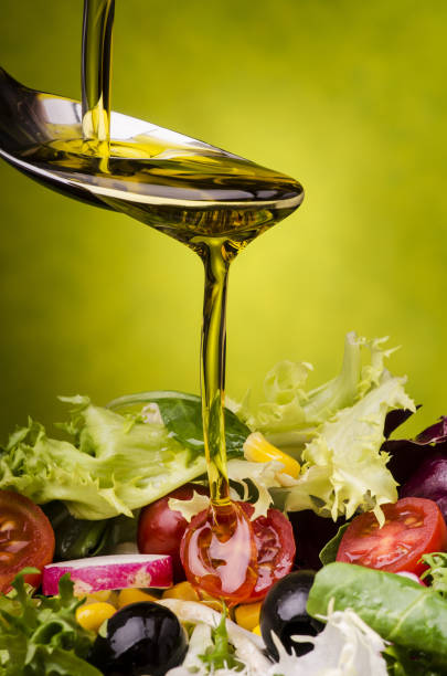 istock fresh salad dressed with olive oil 944303784