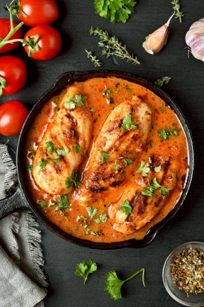 istock Chicken breast in tomato sauce 944309886