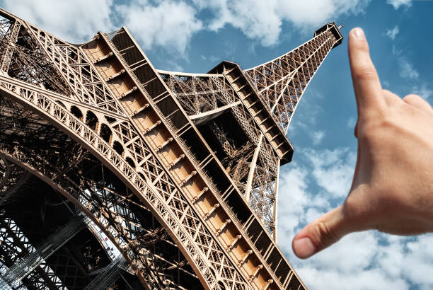 istock Eiffel tower in Paris on blue sky measuring tower palm 944309960