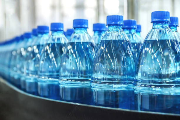 istock Closeup on mineral water bottles in raw and lines 944310342