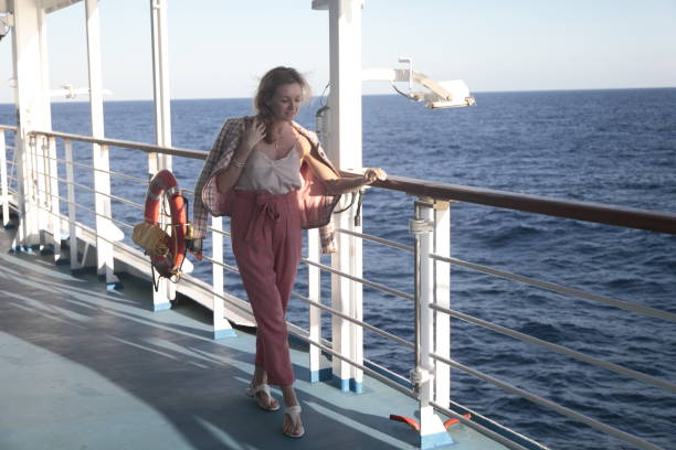 istock Woman Enjoying the Sea Aboard Ship 944311412