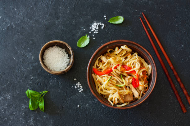 istock Udon noodles and vegetables served in the clay pot 944317744