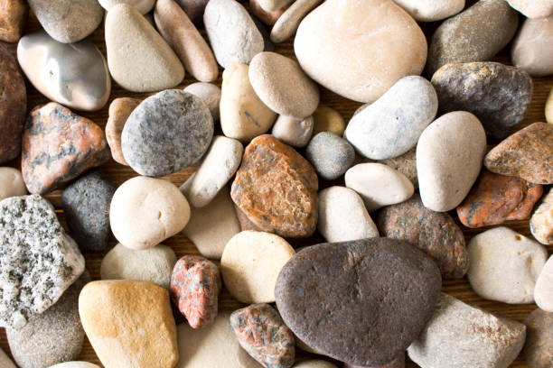 istock A lot of sea pebbles scattered around the table 944318048