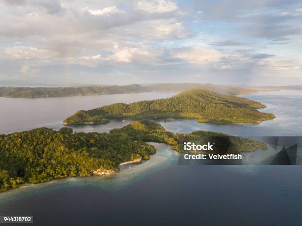Aerial Of Beautiful Islands In Raja Ampat Stock Photo - Download Image Now - Papua New Guinea, Aerial View, Snorkeling