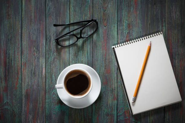 istock A cup of coffee in the workplace on a wooden table. 944319650